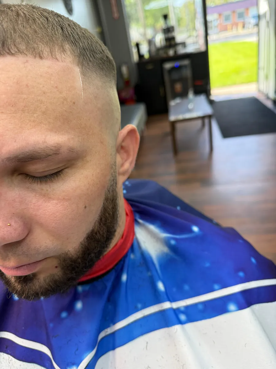 Beard lineup and fade, profile view