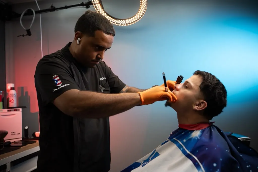 Detailed facial and eyebrow work on a client