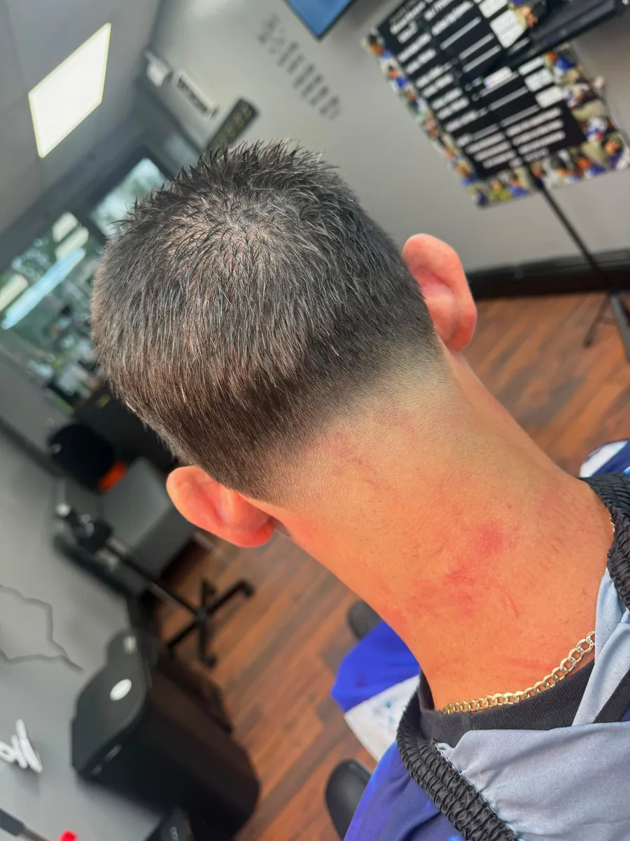Mid fade haircut seen from behind